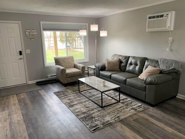 Spacious living room with cozy furniture! 