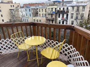 Private deck with chairs + Weber BBQ and sunrise views of brownstone Brooklyn