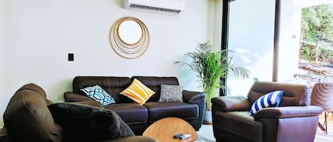 Living room boasts Italian genuine leather furniture