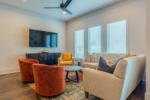 Living room with large flat screen TV. Main floor (2nd floor)