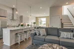 View of living area and kitchen.  