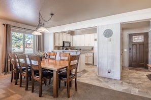 dining area, kitchen and entry.