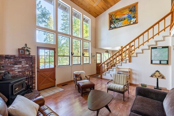 Bright living room with fantastic views. TV/movies now also located downstairs.