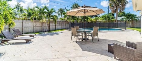 Lounge here right by the pool! Enjoy dining out in our 4 seater outdoor dining table with big umbrella or relax in one of these 2 lounge chairs by the pool! 