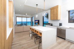 Full kitchen with island seating. 