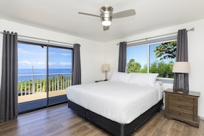 Bedroom 1 with King bed, lanai access, and en-suite