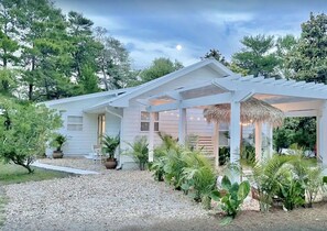 Authentic beach cottage charm unites with tropical bohemian oasis