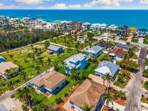 Wake up steps from Bonita Beach—feel the sand between your toes in minutes