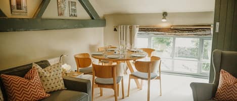 First floor: Picturesque views from the dining table and sofa onto open countryside towards Miller's Dale