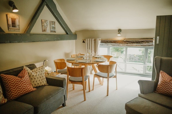 First floor: Picturesque views from the dining table and sofa onto open countryside towards Miller's Dale