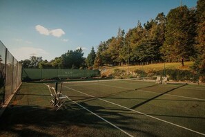 Shared use of an all-weather tennis court across the road