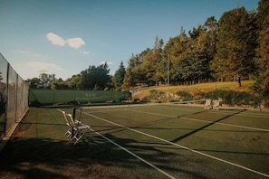 Shared use of an all-weather tennis court across the road