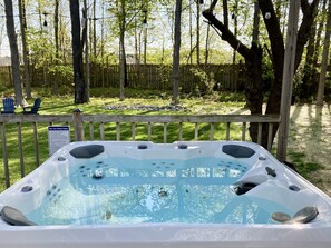 Enjoy the serenity of our fully fenced backyard while soaking in the hot tub!