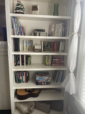 Books, games, and a guitar.