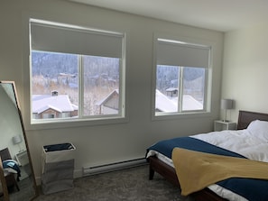 The master bedroom has a beautiful view of the valley, ski runs, and gold course