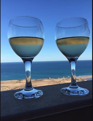 Enjoy a glass or two of vino on the private balcony.