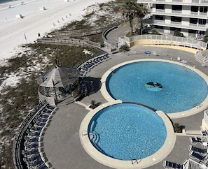 Outdoor pool as viewed from 702A Patio (non-heated) open through 8/19/2024 then closes through 4/2025.