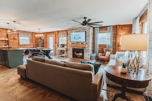 Open Living Room with 55" TV & Kitchen