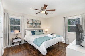 Master bedroom - king size bed, 43” TV, dresser, walk-in closet w/ en suite