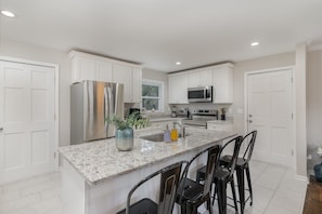 Modern Kitchen stocked with all the essentials for a home cooked meal