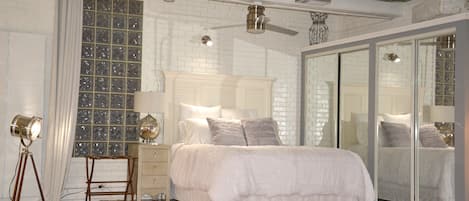 Master bedroom elevated over main living area. Curtains offer serenity @ Night!