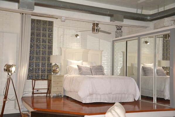 Master bedroom elevated over main living area. Curtains offer serenity @ Night!