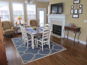 Eating area in kitchen with view of backyard and deck access.