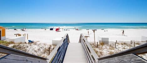 White sand private beach and Emerald water just outside building