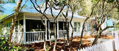 Front of cottage, screened porch.