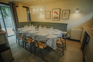 Ground floor: Large dining area in the kitchen with seating for up to 15