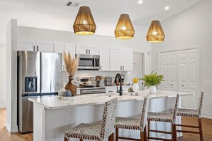 Pull up a chair and chat with the chef in this spacious modern kitchen