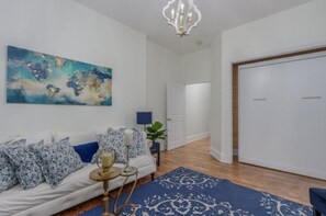 Entry bedroom queen Murphy bed with twin 55” smart tv