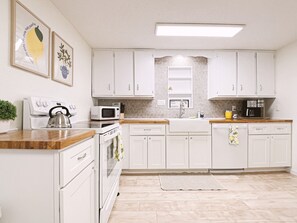 Brand new cabinets and butcher block countertops for a fresh, clean experience