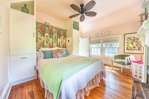 Queen bedroom with lofted ceilings and many original period details. 