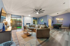 Relax in the spacious living room with a Smart TV for entertainment.