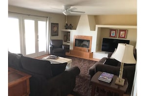 living room w wood burning fireplace