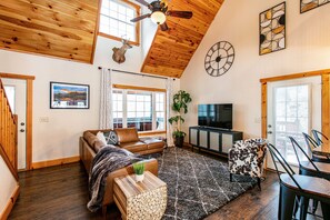 Kick back in this stylish, modern-rustic living room! First of 2 living rooms!