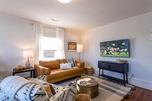 Upscale Condo with TV and Leather Sofa