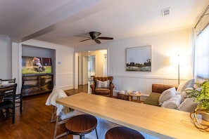 Bar Stool Seating Looking into Living Room with TV