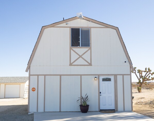 Cozy Corral front door entrance and driveway parking.