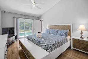 Master bedroom with doors to the pool area