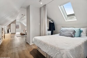 Top floor bedroom with a double bed.