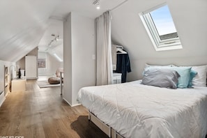 Top floor bedroom with a double bed.