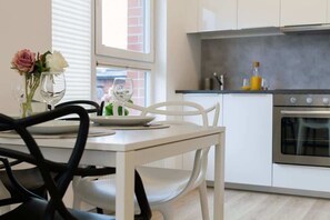Fully equipped kitchenette with a dining area