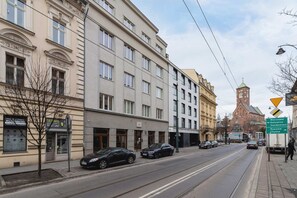 A street view showcasing a historic urban neighborhood with elegant architecture.
