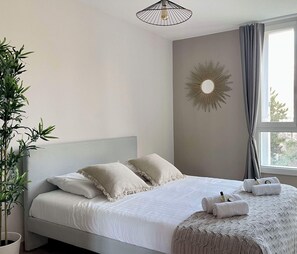 Large double bed in a well-lit room