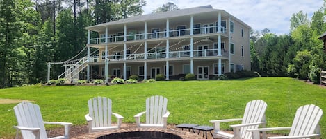 Our waterfront home. Large gently sloping grass backyard on the water.