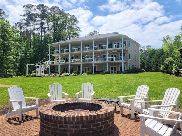 Our waterfront home. Large gently sloping grass backyard on the water.