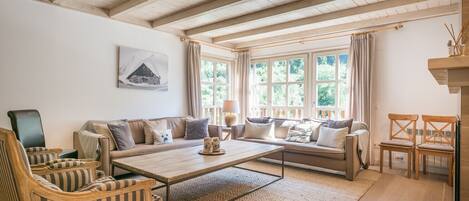 Nice living room of the house Eth Mur by Totiaran, Val de Ruda Urbanization, at the foot of the slopes
