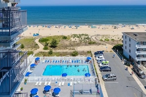 Birds Eye view of heated pool deck, tennis court. Positioned to recieve full day of sun. 